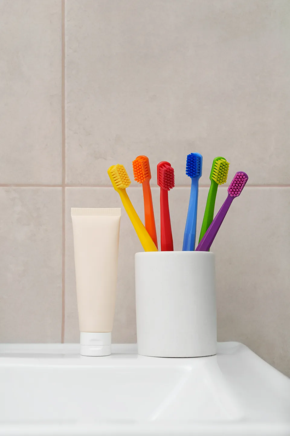 Children’s toothbrushes in a cup