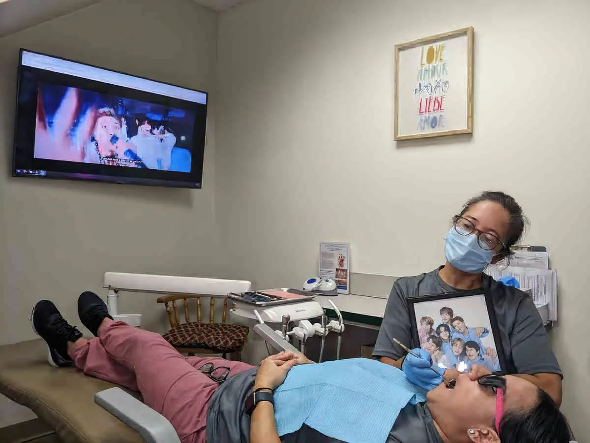 A treatment room with a screen on the wall